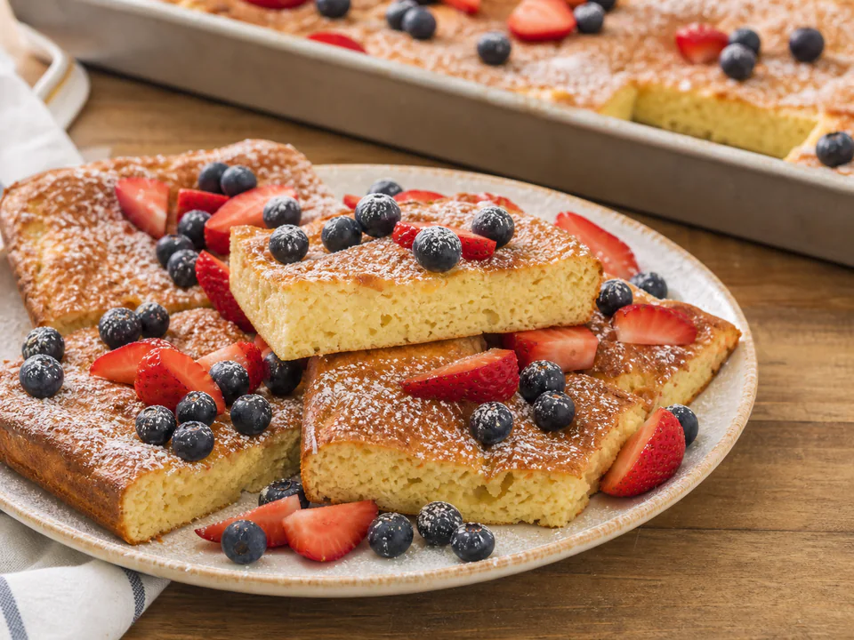 Close detail of the tender crumb and browned top of a baked pancake square