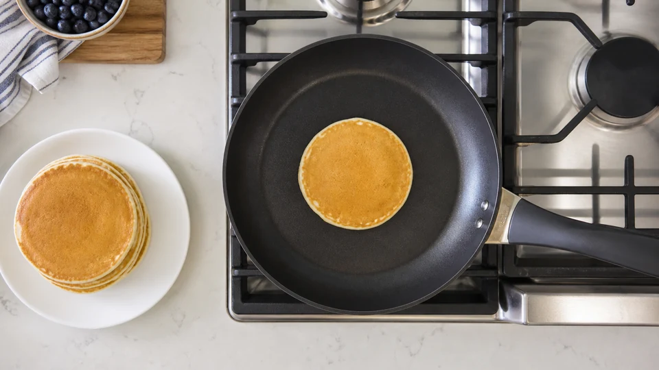 Editorial breakfast scene illustrating Match Pancake Pan Size to Burner Size