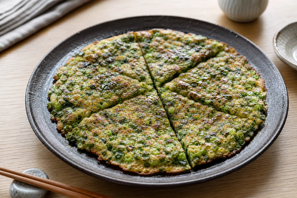 Finished thin negiyaki visibly packed with green onions.
