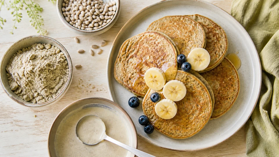 Sunflower seeds, seed flour, batter and browned pancakes in a controlled sequence