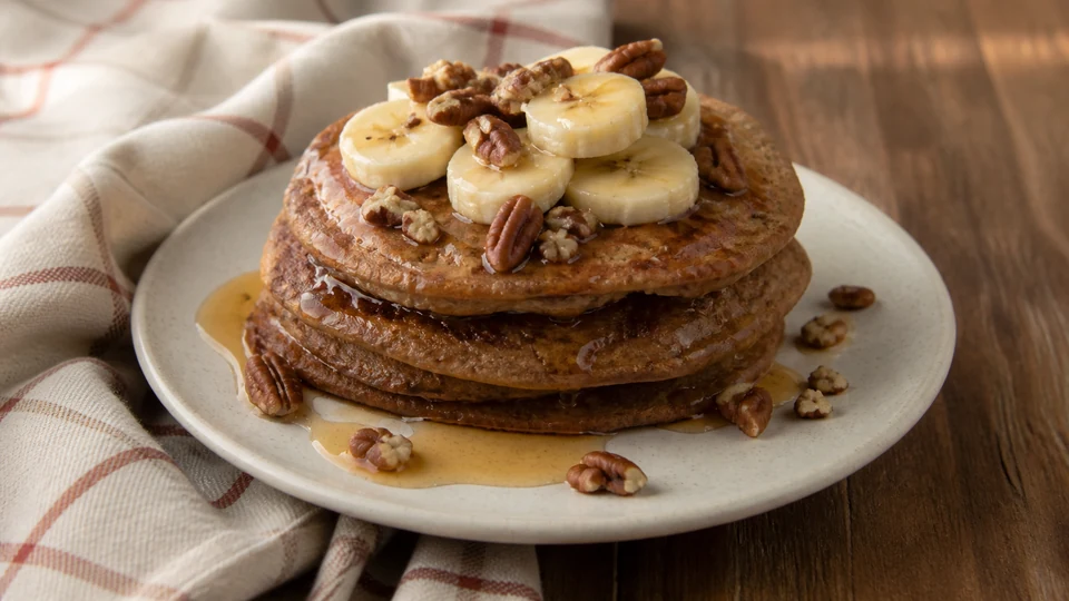 Vegan whole wheat banana pancakes prepared for Pancake World.